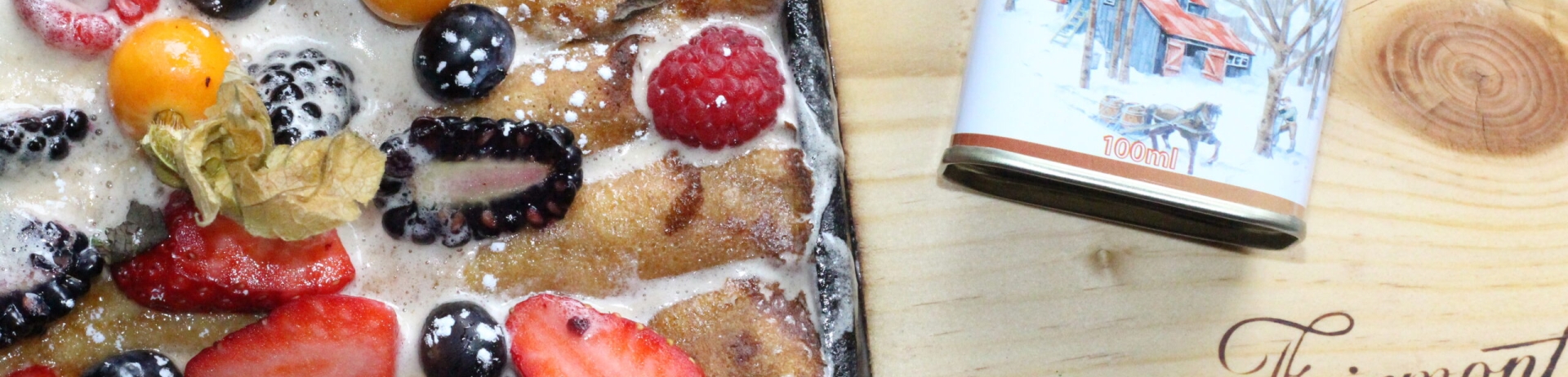 Tray of fruit and a jar of maple syrup