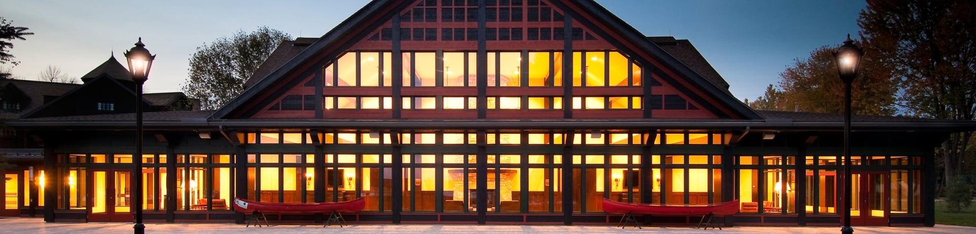 Exterior shot of the chateau at night with all the interior lights on