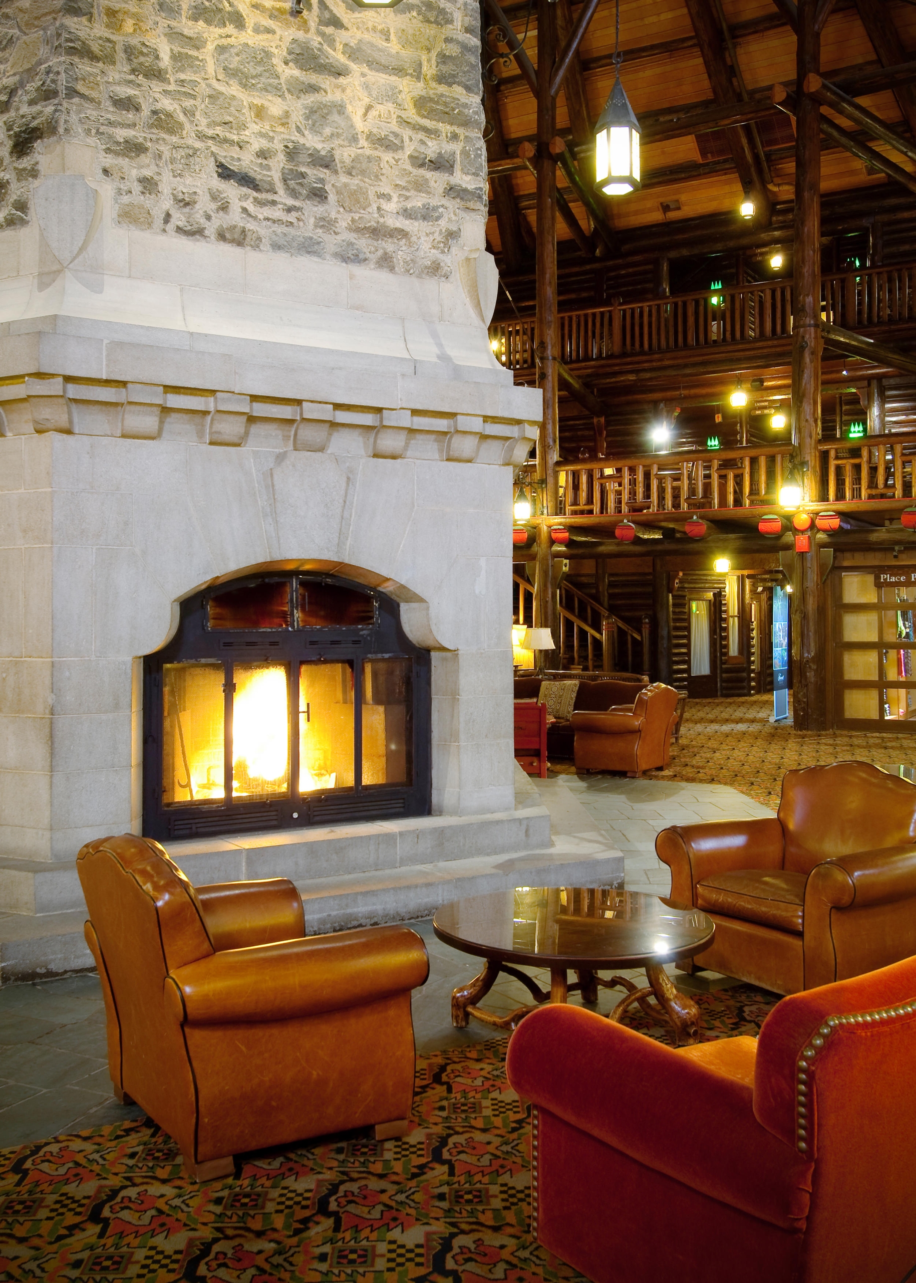 sitting area next to a large fireplace
