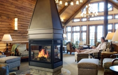 woman sitting next to the fire in the spa waiting room