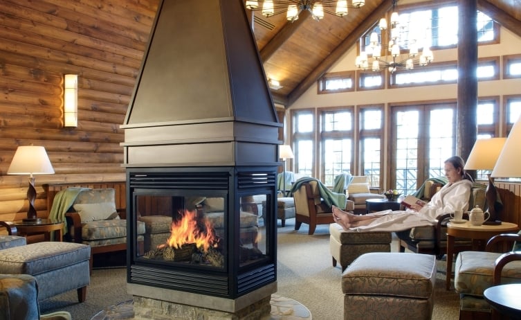 woman sitting next to the fire in the spa waiting room
