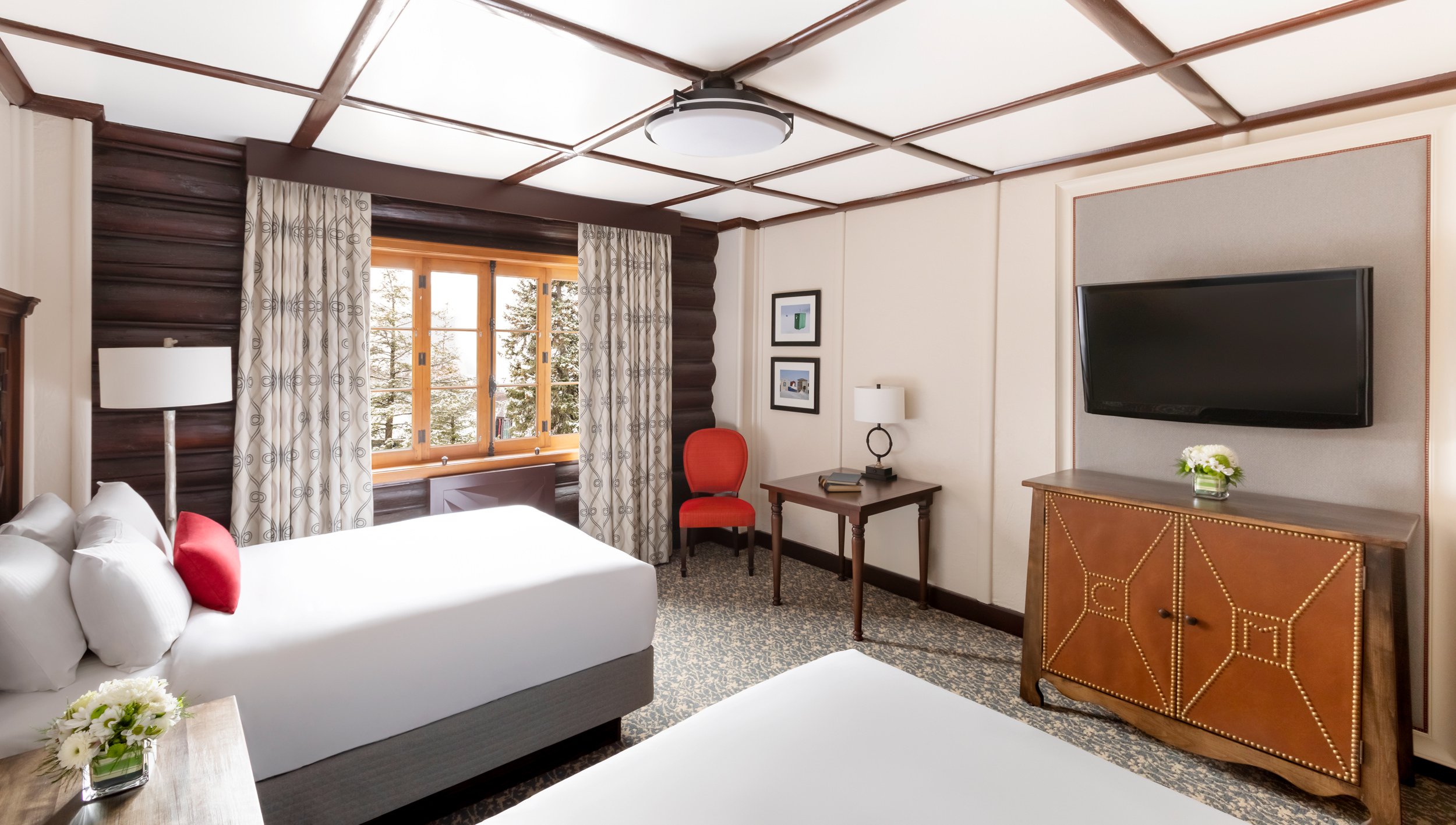 bedroom with two twin beds and forest view