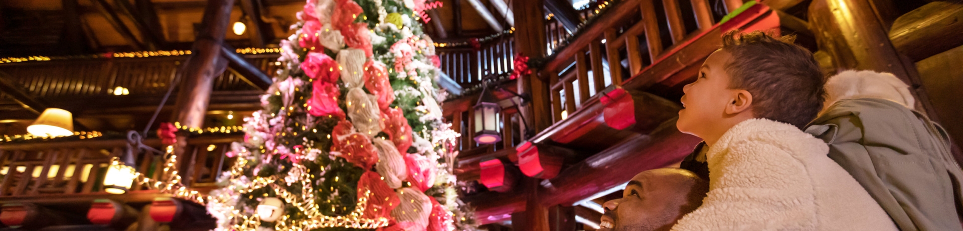 a family enjoying the festive decorations in the lobby